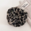 Close-up of fluffy leopard print scrunchie with soft woolly texture in dark green and grey - Hair Tie / Dark Green
