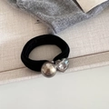 Detail of high-elasticity hair tie featuring a silver metal bead and heart-shaped crystal - Champagne Bead Heart Rhinestone