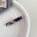Detail of gradient acetate hair clip featuring seven connected heart shapes in blue and purple - Iridescent Blue