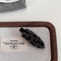 Close-up of leopard print wool hairpin with soft texture and black duckbill clip detail - Grey Leopard
