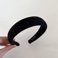 Detail of black velvet sponge headband with silver polka dots and gold interior logo - Black