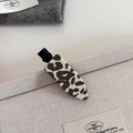 Close-up of retro leopard print fabric hair clip with a matte black metal duckbill grip - 2#Cream Leopard