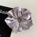 Detailed close-up of large velvet scrunchie in dusty purple with elegant folds - Large / Light Gray Pink