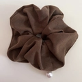 Deep brown corduroy hair scrunchie with pearl pendant accessory on a beige background - Coffee