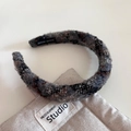 Close-up of handmade retro plaid tweed headband with textured gray and black fibers - Black Gray Series - Sponge Headband