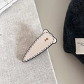 Vintage bären-haarklammer in creme mit schwarzen nähten und goldenem bären-akzent - Weiß