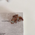 Detailed close-up of acetate hair claw clip showing marble pattern and metal spring - Wavy M-Shape Claw / Green Coffee Pattern