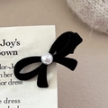 Elegant black velvet bow hair clip with central pearl on card with knit background - Pearl Bowknot / Black