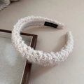 Detail of soft cream boucle lamb wool headband with handmade label and fuzzy texture - Handmade Headband / Beige Apricot