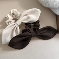 Detail of cream and dark brown oversized bow hair ties in textured twill fabric - White
