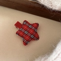 Close-up of red and black buffalo plaid star hair clip on soft beige plush background - Red Plaid Star Hair Clip