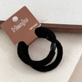 Close-up of black elastic hair bands with secure oval bead on branded display card - Screw Back / Black