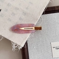 Close-up of pink marble acetate hair clip with gold glitter on a rustic linen background - Pink Multi