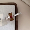 Pince à cheveux élégante avec nœud et strass sur un fond de texture bois rustique - Style Nœud Translucide Marron / Café Clair