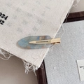 Macro shot of marble texture resin hair clip with gold glitter and metal duckbill clip - Royal Blue