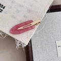Close-up of pink pearlescent acetate hair clip with glitter on soft linen background - Rose Pink