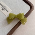 Detail of olive green acetate hair clip with hollow lace edges and bow design - 11# Green Hair Clip