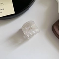Detailed close-up of acetate hair clip with France Handmade logo and pearl finish - Phantom White Marble