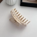 Detail of marble ink pattern butterfly hair claw with metal spring and acetate finish - Creamy White
