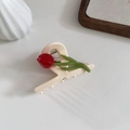 Close-up of a cream tulip hair claw clip with red flower and green stem details - White