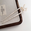 Elegant pearl white acetate U-shaped hair pin with gold rabbit ear detail for hair buns - Mermaid White