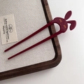 Detailed close-up of wine red rabbit acetate hair pin with dual-prong U-shaped design - Retro Copper