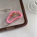 Detailed view of the bright pink acetate claw clip with a premium golden metal frame - Rose Red