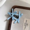 Light blue ribbon bow hair clip on a wooden tray with a sweet ballet style aesthetic - Blue