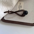 Minimalist dark brown translucent banana hair clip with a large black pearl accent - Black and Gray