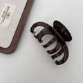 Macro view of a 13cm dark amber hair claw clip with smooth polished finish on white backdrop - Dragon Bone Style / Dark Amber Brown