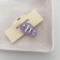 Pinza para el pelo con forma de pez morado brillante en resina sobre tarjeta de cartón - Púrpura