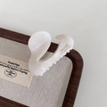 Detail view of cream white pearl hair claw clip with golden Barrette La France lettering - Mermaid White