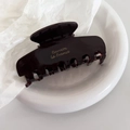 Detailed macro view of dark coffee acetate hair claw with golden Barrette la France text - 8# Chocolate Coffee