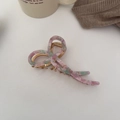 Haarklammer aus Acetat in Marmoroptik mit Schleifendesign und goldener Metallfeder - Rosa und Grün
