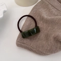Detail showing the curved emerald resin rectangle with FRANCE Handmade engraving on band - Green