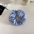 Blue and white striped fabric scrunchie on a decorative white textured surface - Dark Blue Bold Striped