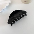 Dettaglio di una grande pinza per capelli nera lucida in acetato di alta qualità - Grande / Nero