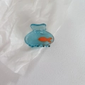 Translucent blue hair claw clip with orange fish and bubble details in resin material - Blue