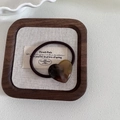 Detailed macro view of an amber resin heart pendant on a brown elastic hair tie - 3# Brown Heart
