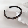 Close-up of rhinestone and satin braided headband texture with non-slip inner teeth - Light Coffee