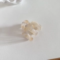 Detail of cream marble acetate hair claw clip showing the geometric rectangular structure - Apricot