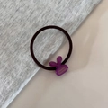 Detail of purple rabbit resin charm on brown elastic hair tie with France Handmade text - Purple