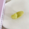 Detailed view of the yellow heart-shaped acrylic hair clip with a marble texture finish - Ink Wash Yellow