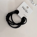Detail of durable black elastic hair bands set on a white card with braided texture - Black