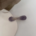 Detailed view of a purple marble resin hair clip on a minimalist white stone base - Gentle Purple