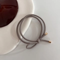 Taupe high-elastic hair tie with gold cylindrical metal cap and ribbed texture - Light Gray