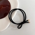 Elastic hair tie in black double-strand design with refined golden metal cylinders - Black