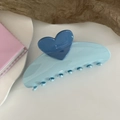Macro detail of 13cm light blue claw clip featuring a dark blue 3D heart design - Heart Hair Claw / Blue