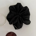 Close-up of black satin scrunchie with white pearl trim showing silky texture details - Large / Black