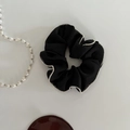 Detail of elegant black satin scrunchie with white micro pearl bead trim on smooth fabric - Small / Black
